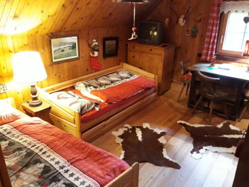 Postel nebo postele na pokoji v ubytování Chalet Hüttentraum by Globalimmoservice