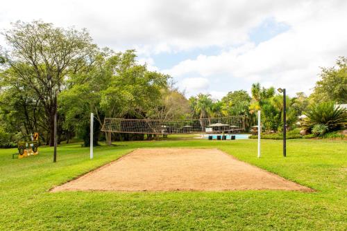 a volleyball court in a park with a net at Kruger Park Lodge - Modern Unit 225B in Hazyview