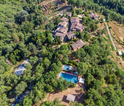 an aerial view of a house with a swimming pool at Il Ginepro Home in Rosennano