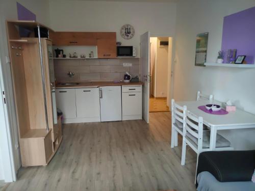 a kitchen with a table and a table and a dining room at Olsinky in Ústí nad Labem