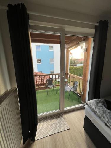 a room with a sliding glass door to a balcony at VW WERK Wolfsburg Wohnung 4 Betten ein Preis in Oebisfelde