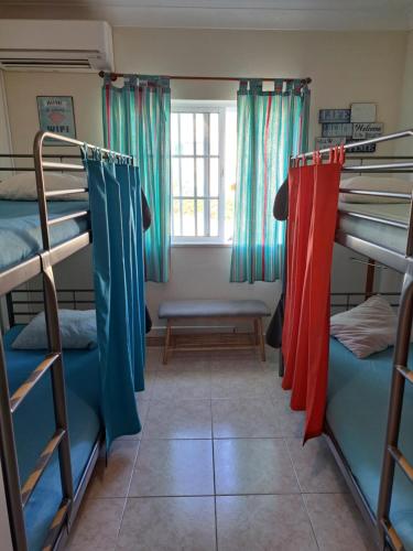a room with bunk beds and a window at My Guest House in Portimão