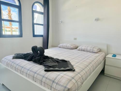 Postel nebo postele na pokoji v ubytování Cozy Bungalow playmar 23