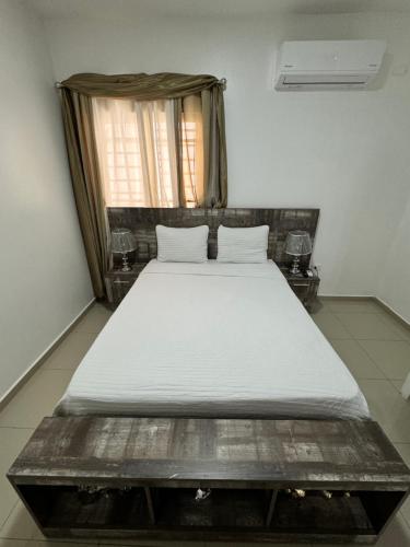 a bedroom with a large bed in a room at Paramount 3-Bedroom Apartment with Parking in San Felipe de Puerto Plata