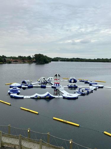 a bunch of boats are parked in the water at Hot tub retreat at Tattershall Lakes in Tattershall