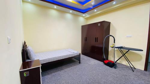 a room with a bed and a table and a ceiling at Cityscape luxury residence in Kabul