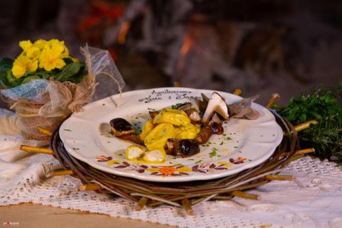 a plate of food sitting on top of a table at Agriturismo Terra e Sapori in Campodipietra