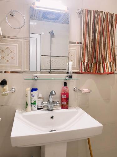 a bathroom with a sink and a mirror at Cityscape luxury residence in Kabul