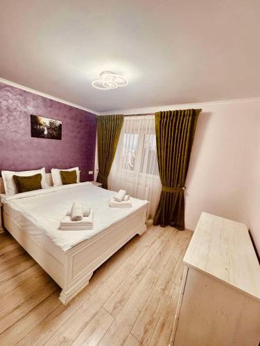 Ένα ή περισσότερα κρεβάτια σε δωμάτιο στο M & C Apartament