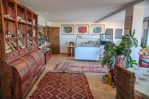 a large room with wooden cabinets and a kitchen at Hotel Boutique Aldea del Mar in Pichilemu