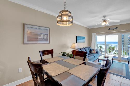 a dining room with a table and a couch at Crystal Tower 508 by Vacation Homes Collection in Gulf Shores