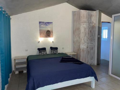 Ένα ή περισσότερα κρεβάτια σε δωμάτιο στο Villa Carocanne