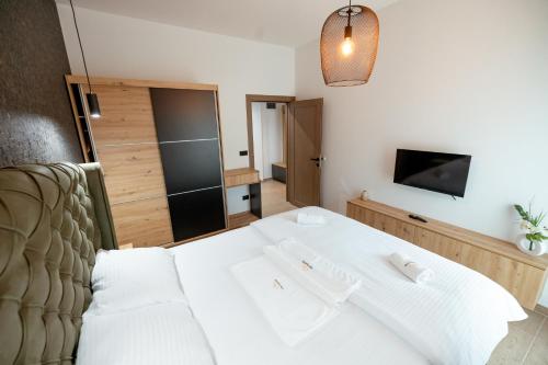 Top Zlatar Apartmaniにあるベッド