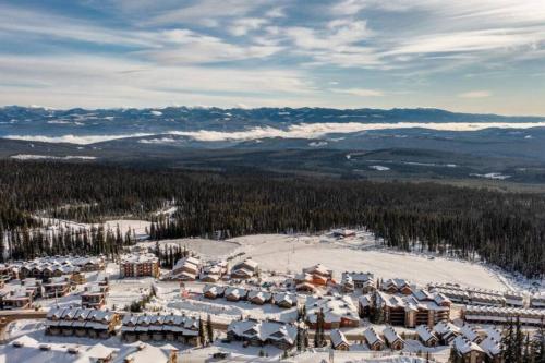 an aerial view of a ski resort in the snow at Winter Escape On Perfection - Ski In Out, Pool & Hot Tub in Big White