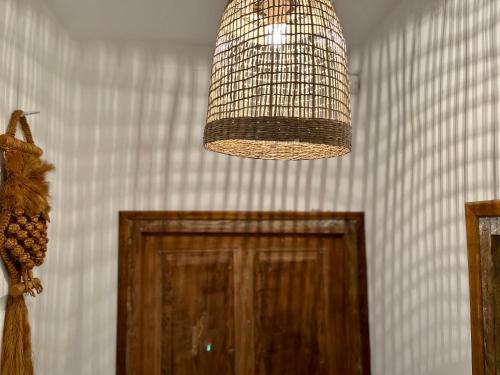 a chandelier hanging over a door in a room at Housica & Co. in Ucciani