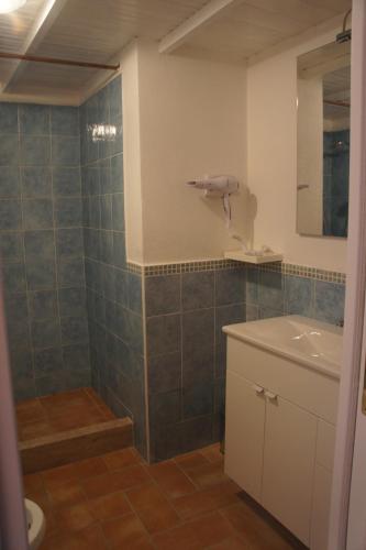 a bathroom with a sink and a mirror at Locanda FarOrientale in Santa Lucia