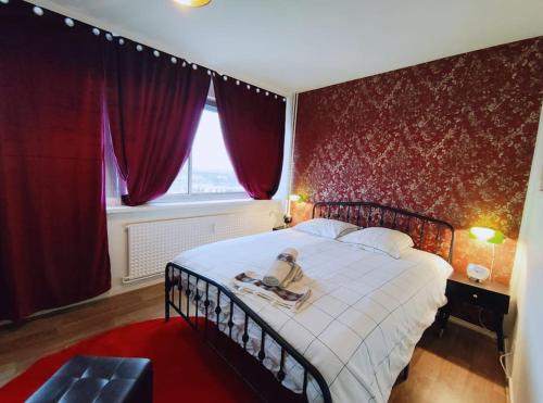 Ένα ή περισσότερα κρεβάτια σε δωμάτιο στο Rétro Romance in Mulhouse