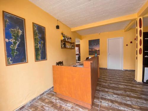 an empty room with a counter in a room at Picco da Ilha Hostel in Florianópolis