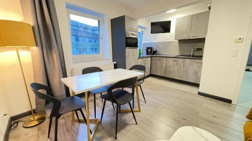 Η κουζίνα ή μικρή κουζίνα στο Home Apartments