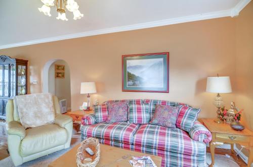 a living room with a couch and a chair at 1 Mi to KFC Museum Corbin Getaway! in Corbin
