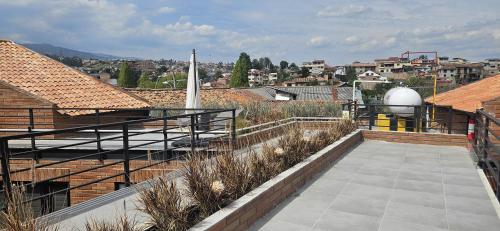 a balcony with a view of a city at Apartamento con encanto cerca del centro de Cuenca in Cuenca