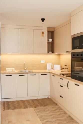 Una cocina o zona de cocina en Lux Snowflake Poljice Jahorina