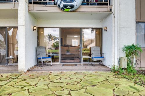 a patio with chairs and a table in a building at Waterfront Condo on Lake Conroe with Boat Launch! in Montgomery