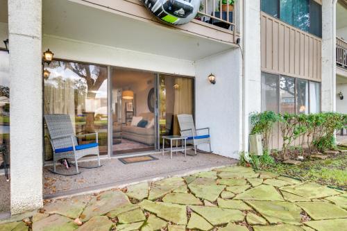 a house with a patio with chairs and a couch at Waterfront Condo on Lake Conroe with Boat Launch! in Montgomery