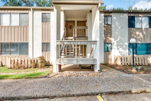 a house with a porch and a balcony at Waterfront Condo on Lake Conroe with Boat Launch! in Montgomery