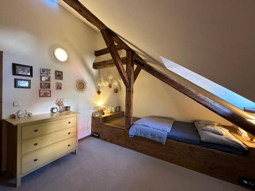 a bedroom with a wooden bed and a wooden dresser at Apartmán v Žltom dome in Banská Štiavnica
