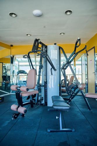 a gym with cardio equipment and chairs in a room at South American Copacabana Hotel in Rio de Janeiro