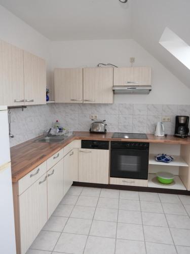 Kuchyň nebo kuchyňský kout v ubytování Appartement Am Goldberg