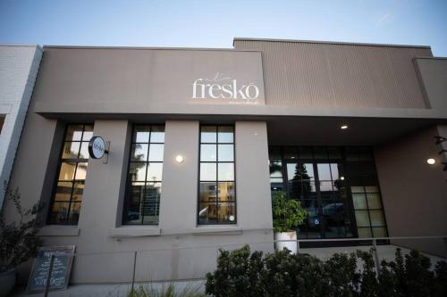 a building with the name of a restaurant at King Suite - Steps to Beach & Close to Pier in Oceanside