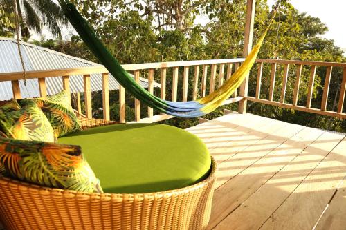 a hammock on a deck with a hammock at La Ceiba, Amazonas in Leticia