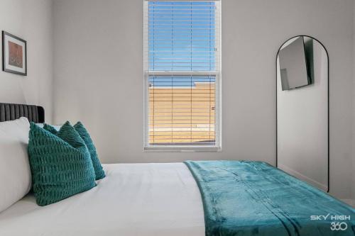 a bedroom with a large bed with a window at Exec King Suites Pool, Gym, Walmart Hq,gym in Rogers