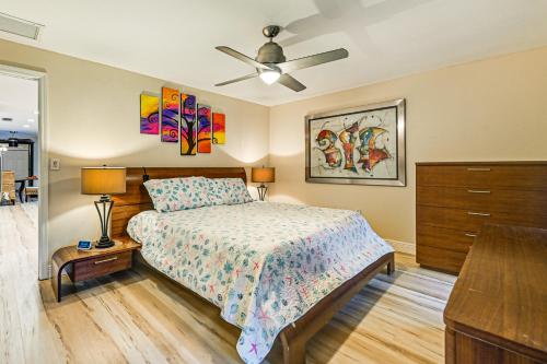 a bedroom with a bed and a ceiling fan at 4 Mi to Beach Pet-Friendly Home in Naples! in Naples