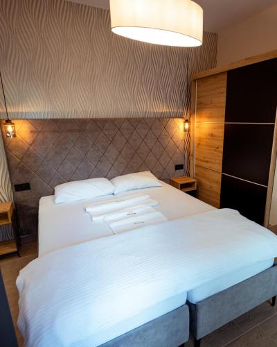Top Zlatar Apartmaniにあるベッド