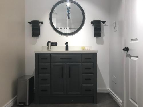 a bathroom with a sink and a mirror on the wall at Canadian Rockies Inn - Adults only in Field
