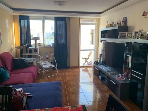 TV a/nebo společenská místnost v ubytování ArYa