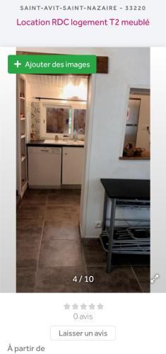 une photo d'une cuisine avec une table dans une pièce dans l'établissement Logement TypeF2 meublé, à Saint-Avit-Saint-Nazaire