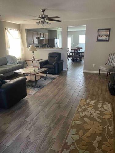 a living room with a couch and a table at House 8122 in Humble