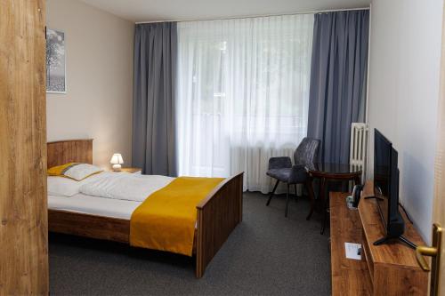 TV a/nebo společenská místnost v ubytování Hotel FIT