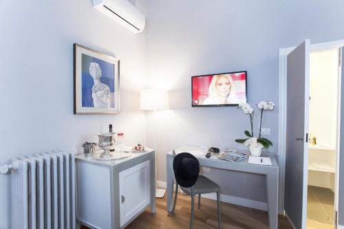 TV a/nebo společenská místnost v ubytování Hotel Il Sole