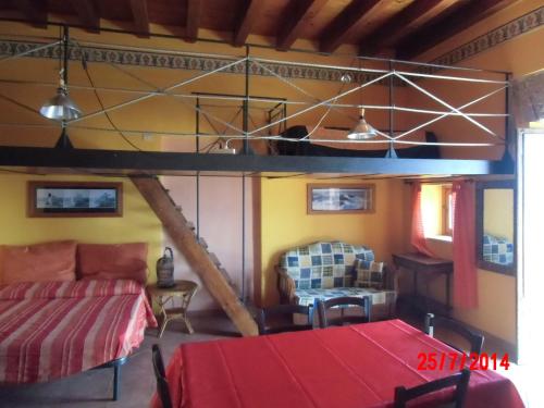 a room with a bed and a loft bed at Holiday home Santa Flavia in Santa Flavia