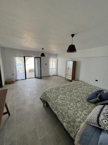 Ένα ή περισσότερα κρεβάτια σε δωμάτιο στο LA SIESTA Suites