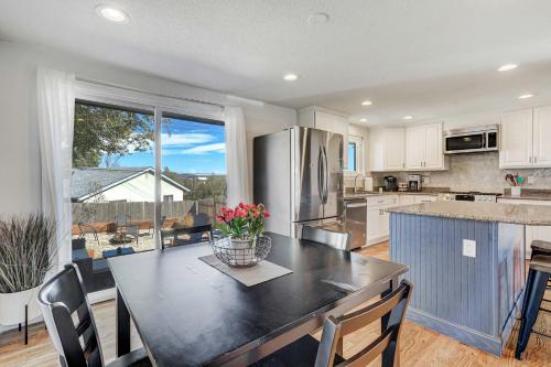 a kitchen with a table and a large window at Cloud View Family Mountain Views & Fire Pit in Colorado Springs