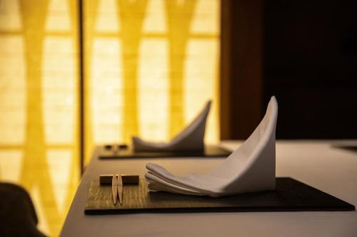a paper boat sitting on top of a table at Hotel Utano Kyoto Besho in Kyoto