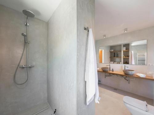 a bathroom with a shower and a toilet and a sink at Villa in Cala Vadella near Es Vedrà Views in Cala Vadella