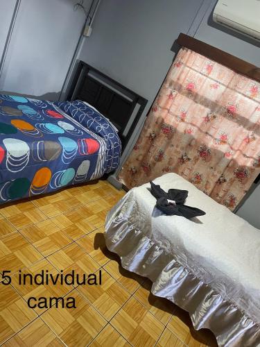 Voodi või voodid majutusasutuse Managua Hotel Oasis toas