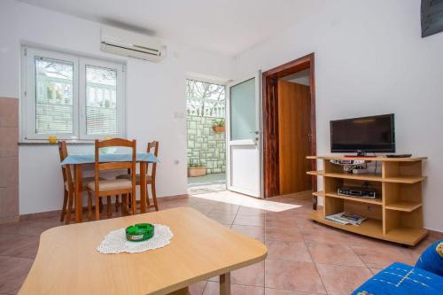 Apartments and rooms with a swimming pool Senj - 23592